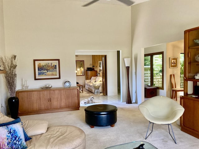 3407 Avenida Madera Unit A, Bradenton, FL 34210 - living room with a towering ceiling, light colored carpet, and a ceiling fan
