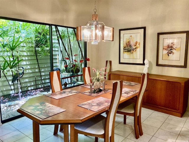 3407 Avenida Madera Unit A, Bradenton, FL 34210 - dining room with a chandelier and light tile patterned flooring
