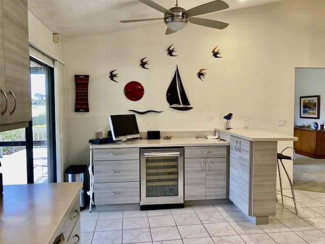 3407 Avenida Madera Unit A, Bradenton, FL 34210 - bar area with wine cooler, a ceiling fan, and light tile patterned floors