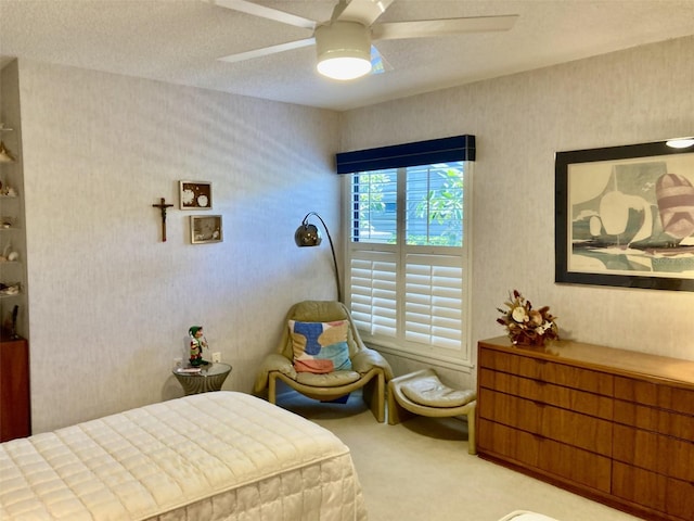 3407 Avenida Madera Unit A, Bradenton, FL 34210 - carpeted bedroom with ceiling fan, a textured ceiling, and wallpapered walls