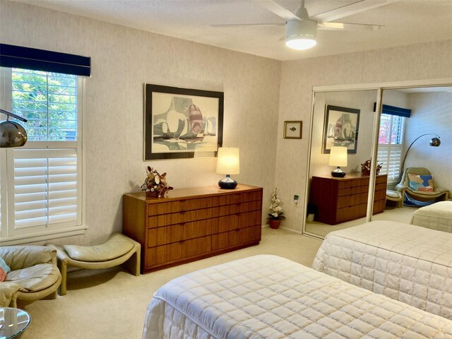3407 Avenida Madera Unit A, Bradenton, FL 34210 - bedroom with carpet, a closet, and ceiling fan