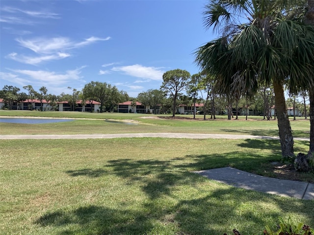 3407 Avenida Madera Unit A, Bradenton, FL 34210 - view of community featuring a lawn and a water view