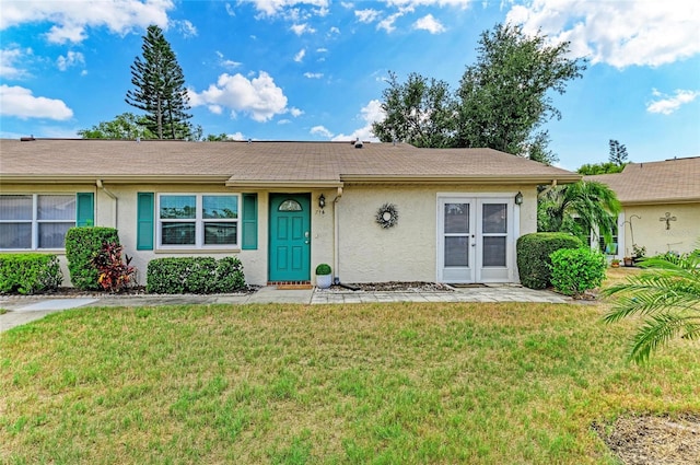1906 Canterbury Ln Unit 16, Sun City Center, FL 33573 - ranch-style home featuring stucco siding and a front lawn