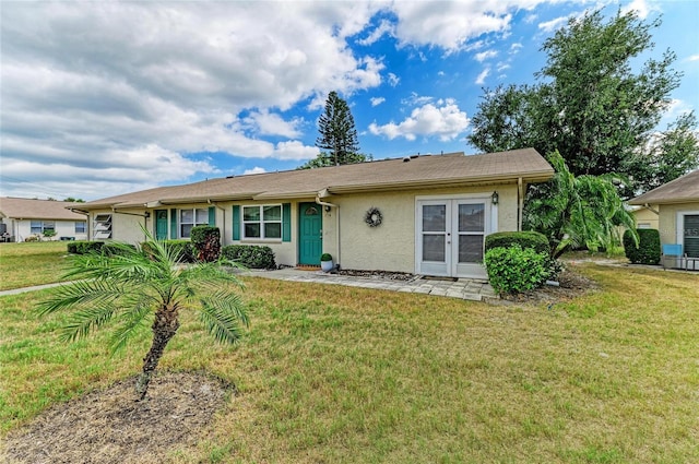 1906 Canterbury Ln Unit 16, Sun City Center, FL 33573 - view of front of home featuring stucco siding and a front yard