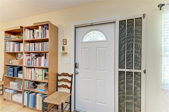 1906 Canterbury Ln Unit 16, Sun City Center, FL 33573 - entryway with a textured ceiling and wood finished floors