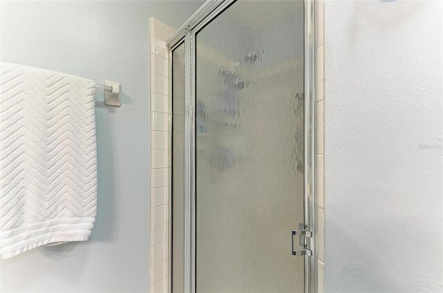 1906 Canterbury Ln Unit 16, Sun City Center, FL 33573 - full bathroom featuring a stall shower