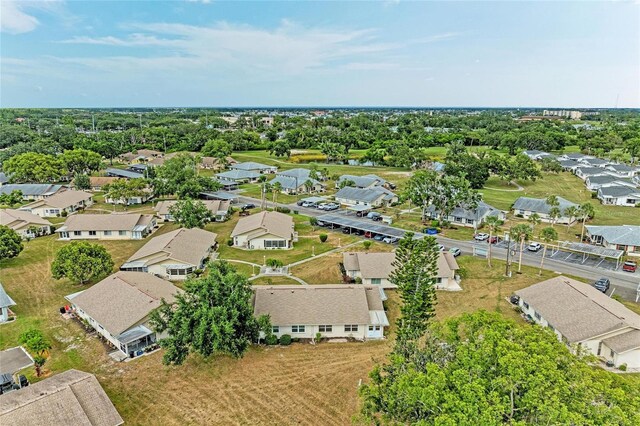 1906 Canterbury Ln Unit 16, Sun City Center, FL 33573 - aerial perspective of suburban area featuring a tree filled landscape
