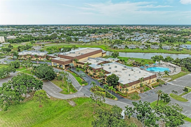 1906 Canterbury Ln Unit 16, Sun City Center, FL 33573 - aerial view of property and surrounding area with a nearby body of water and a pool