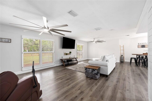 2255 61st St, Sarasota, FL 34243 - living room with ceiling fan, wood finished floors, and baseboards