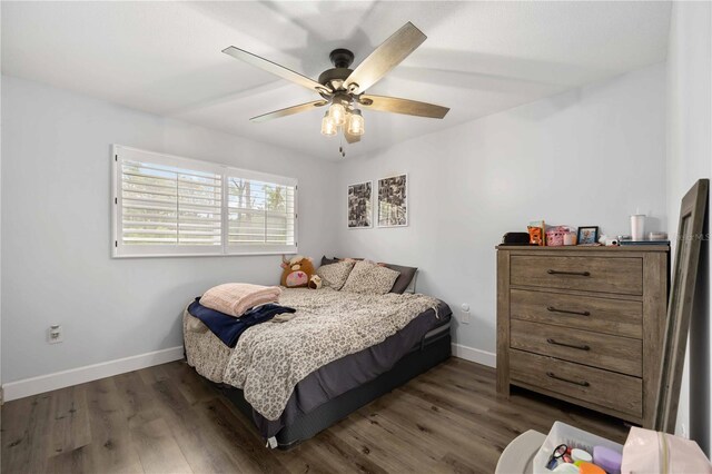 2255 61st St, Sarasota, FL 34243 - bedroom with wood finished floors, baseboards, and ceiling fan
