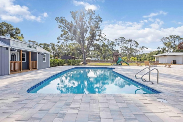 2255 61st St, Sarasota, FL 34243 - view of pool with a patio and an outbuilding