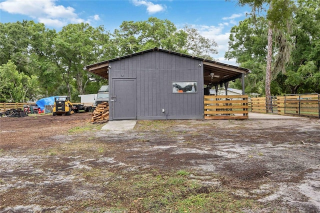 2255 61st St, Sarasota, FL 34243 - view of side of home with an outdoor structure and an exterior structure