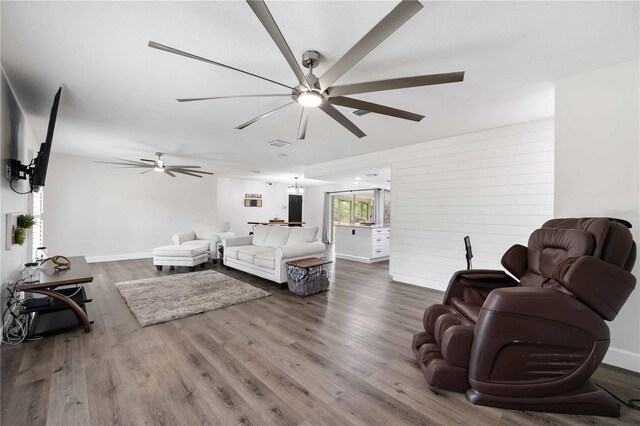 2255 61st St, Sarasota, FL 34243 - living room with a ceiling fan and wood finished floors