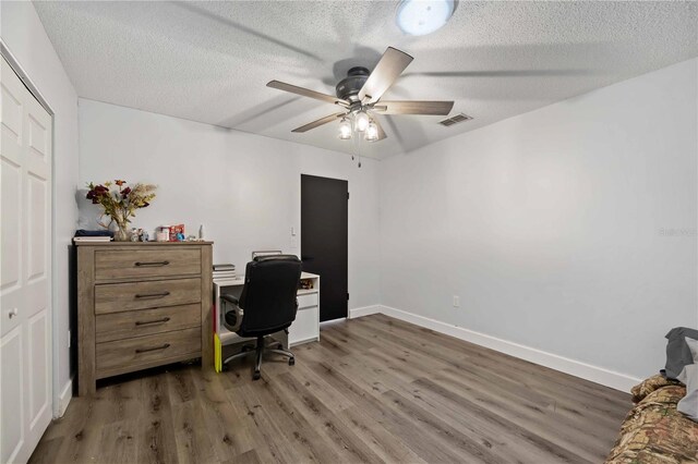 2255 61st St, Sarasota, FL 34243 - office featuring a ceiling fan, wood finished floors, a textured ceiling, and baseboards