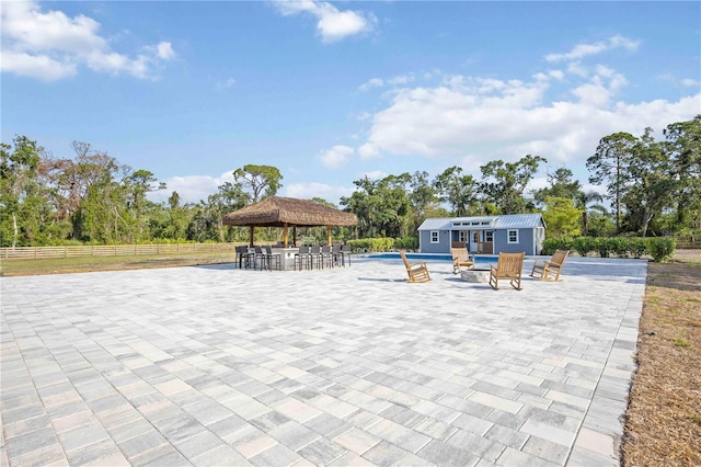 2255 61st St, Sarasota, FL 34243 - view of property's community featuring a gazebo, a pool, a patio area, an outdoor structure, and a storage structure
