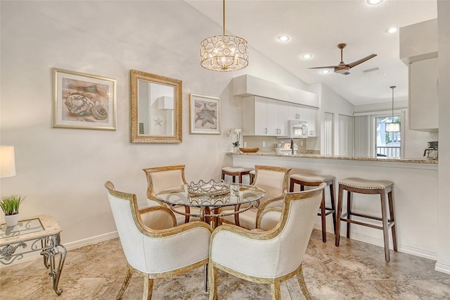 9540 High Gate Dr Unit 1422, Sarasota, FL 34238 - dining area with lofted ceiling, ceiling fan, baseboards, and recessed lighting