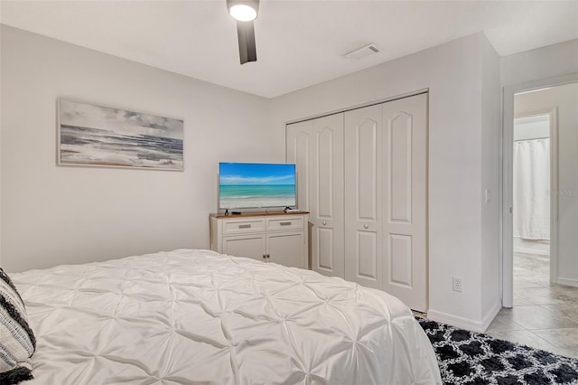 9540 High Gate Dr Unit 1422, Sarasota, FL 34238 - bedroom with a closet, light tile patterned floors, ceiling fan, and baseboards