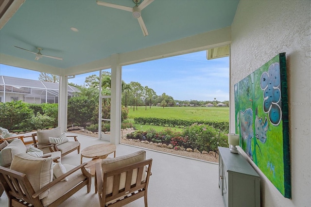 7507 Ascot Ct, University Park, FL 34201 - sunroom / solarium with ceiling fan, carpet, a textured wall, and outdoor lounge area