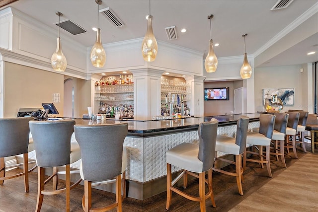 7507 Ascot Ct, University Park, FL 34201 - community bar area featuring wood finished floors, ornamental molding, recessed lighting, and decorative light fixtures