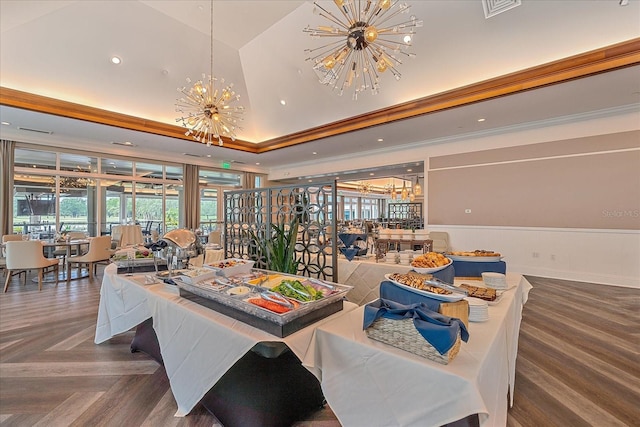 7507 Ascot Ct, University Park, FL 34201 - dining area with a chandelier, a raised ceiling, ornamental molding, wainscoting, and recessed lighting