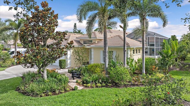 7507 Ascot Ct, University Park, FL 34201 - view of property exterior with stucco siding and a tile roof