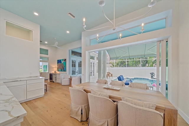 7507 Ascot Ct, University Park, FL 34201 - dining room featuring french doors, light wood-style floors, and recessed lighting