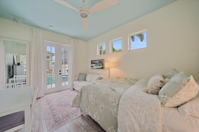 7507 Ascot Ct, University Park, FL 34201 - bedroom with french doors, access to outside, hardwood / wood-style floors, and multiple windows