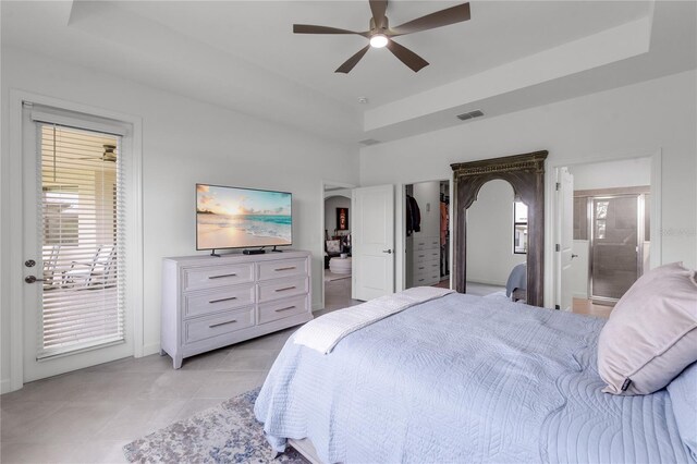 4971 Oyster Pearl St, Bradenton, FL 34211 - bedroom featuring access to outside, light tile patterned flooring, a raised ceiling, a ceiling fan, and ensuite bathroom