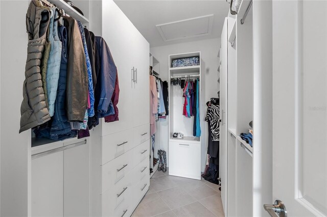 4971 Oyster Pearl St, Bradenton, FL 34211 - walk in closet featuring light tile patterned flooring and attic access