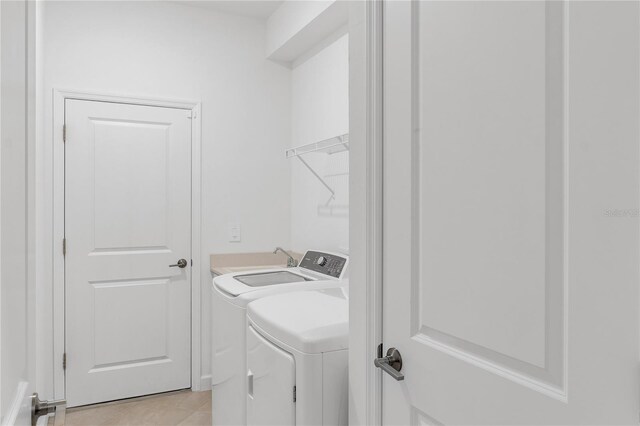 4971 Oyster Pearl St, Bradenton, FL 34211 - laundry room featuring separate washer and dryer and light tile patterned floors
