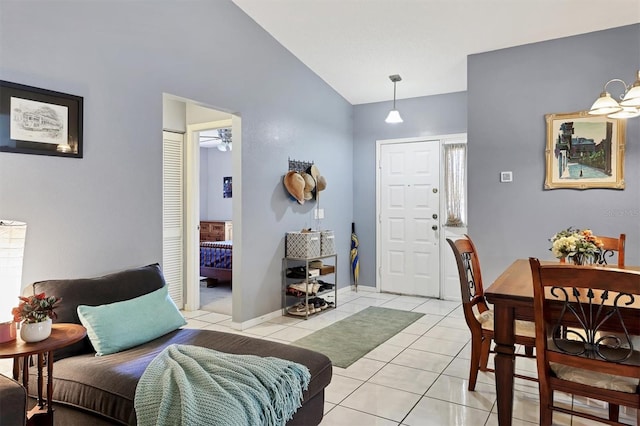 5823 Helen Way, Sarasota, FL 34243 - living room with light tile patterned floors and vaulted ceiling