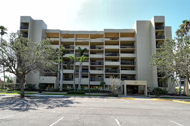 1115 Gulf Of Mexico Dr Unit 304, Longboat Key, FL 34228 - view of apartment building / complex featuring uncovered parking