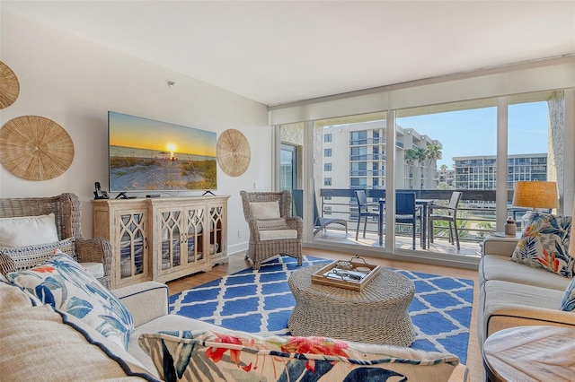 1115 Gulf Of Mexico Dr Unit 304, Longboat Key, FL 34228 - living area with wood finished floors and healthy amount of natural light