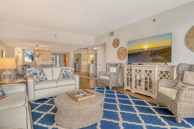 1115 Gulf Of Mexico Dr Unit 304, Longboat Key, FL 34228 - living room featuring wood finished floors