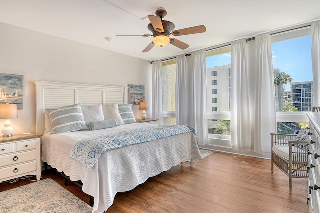 1115 Gulf Of Mexico Dr Unit 304, Longboat Key, FL 34228 - bedroom featuring hardwood / wood-style floors and ceiling fan
