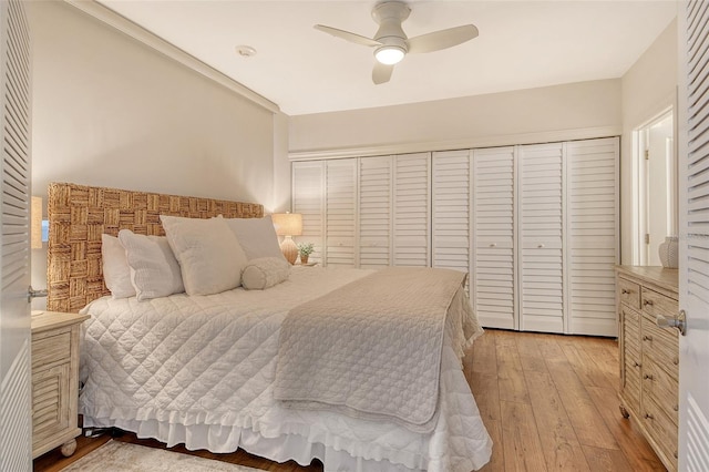 1115 Gulf Of Mexico Dr Unit 304, Longboat Key, FL 34228 - bedroom with light wood-type flooring and a ceiling fan