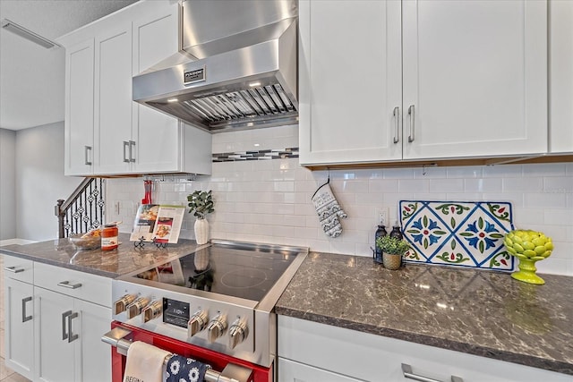 5191 78th St Cir E, Bradenton, FL 34203 - kitchen with range hood, electric stove, white cabinets, decorative backsplash, and dark stone countertops