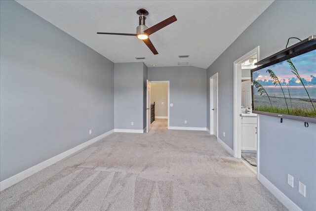 5191 78th St Cir E, Bradenton, FL 34203 - unfurnished bedroom with light colored carpet, baseboards, ensuite bath, and a ceiling fan