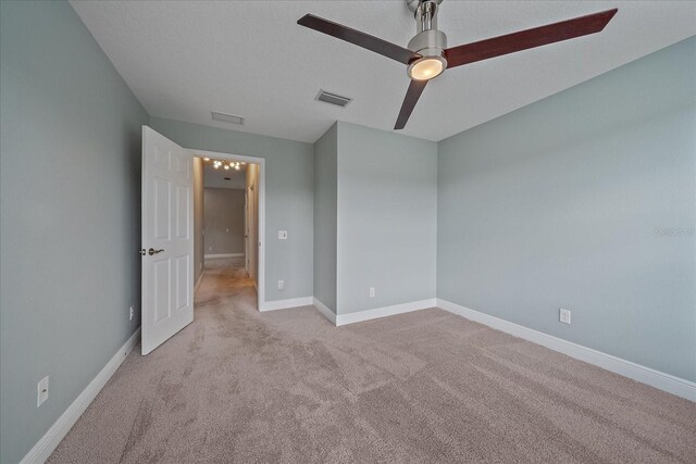 5191 78th St Cir E, Bradenton, FL 34203 - unfurnished bedroom with carpet flooring, baseboards, and a ceiling fan
