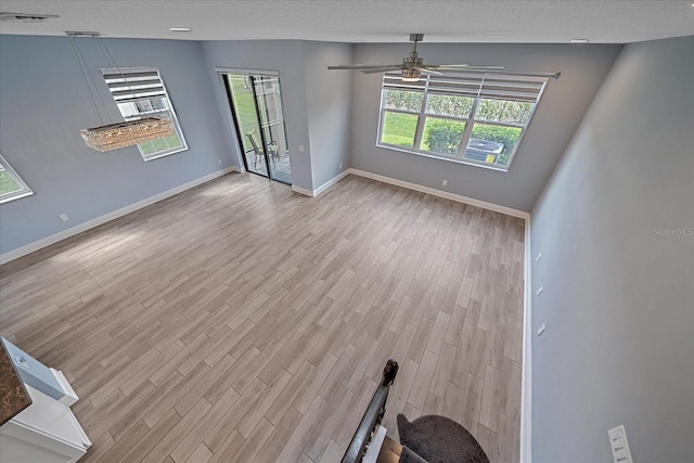 5191 78th St Cir E, Bradenton, FL 34203 - spare room featuring wood finished floors, a ceiling fan, and baseboards