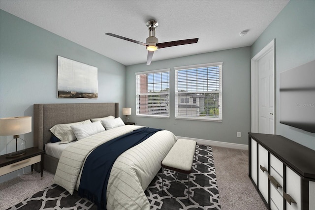 5191 78th St Cir E, Bradenton, FL 34203 - carpeted bedroom featuring baseboards, a ceiling fan, and a textured ceiling