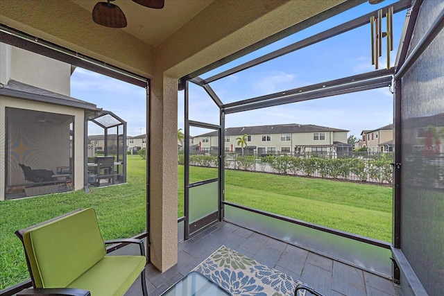 5191 78th St Cir E, Bradenton, FL 34203 - sunroom featuring a residential view and ceiling fan