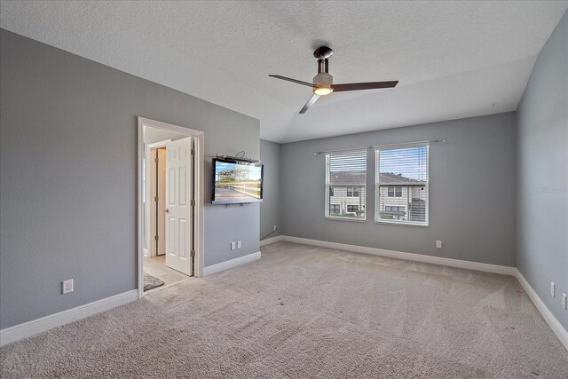 5191 78th St Cir E, Bradenton, FL 34203 - unfurnished bedroom with light carpet, baseboards, a ceiling fan, and a textured ceiling