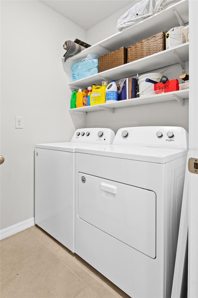 5659 Woodland Sage Dr, Sarasota, FL 34238 - washroom featuring washer and dryer and baseboards