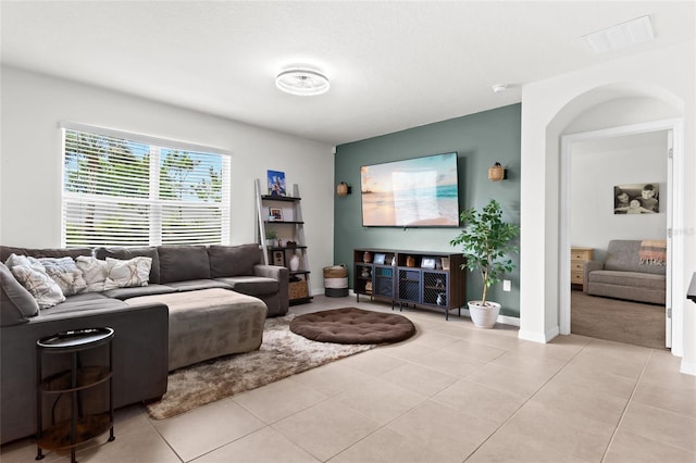 5659 Woodland Sage Dr, Sarasota, FL 34238 - living room featuring light tile patterned floors and baseboards