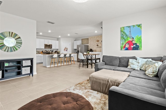 5659 Woodland Sage Dr, Sarasota, FL 34238 - living area featuring light tile patterned floors and recessed lighting
