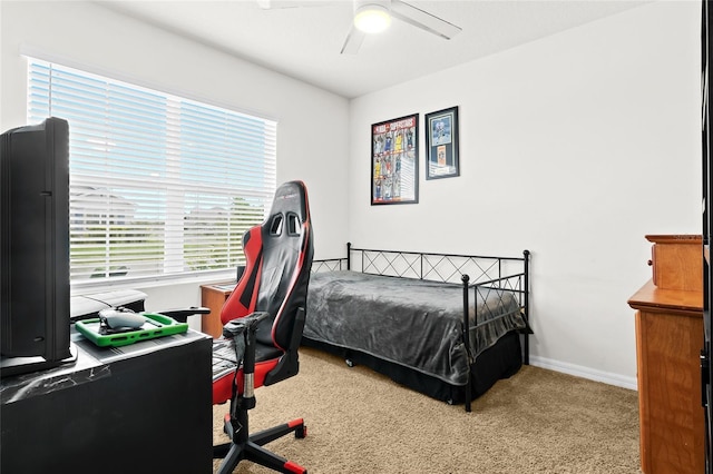 5659 Woodland Sage Dr, Sarasota, FL 34238 - carpeted bedroom featuring baseboards, an office area, and a ceiling fan