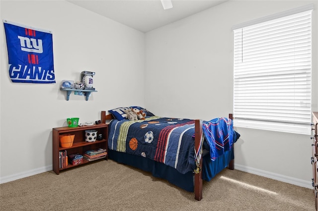 5659 Woodland Sage Dr, Sarasota, FL 34238 - carpeted bedroom with baseboards and a ceiling fan