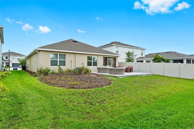 5659 Woodland Sage Dr, Sarasota, FL 34238 - rear view of property with an outdoor hangout area, stucco siding, a patio, and a shingled roof