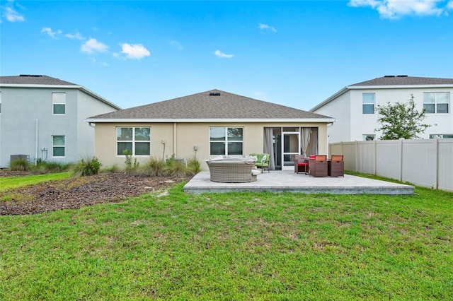 5659 Woodland Sage Dr, Sarasota, FL 34238 - back of house featuring an outdoor hangout area, a patio, stucco siding, and a shingled roof
